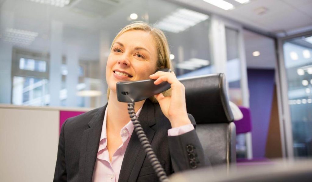 call center representative using a business phone line to make a call