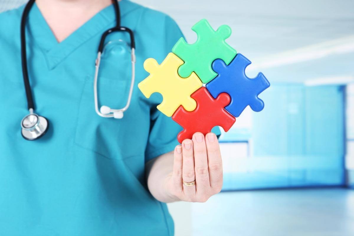 Final thoughts on healthcare bpo services - medical professional holding a jigsaw puzzle