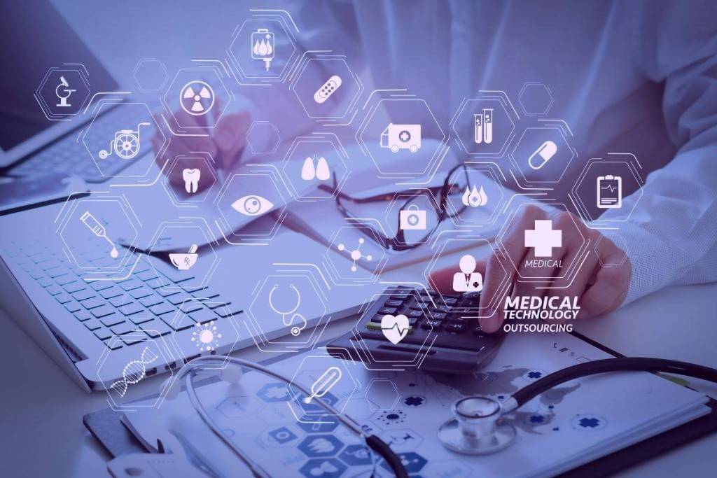 pros and cons of medical billing and coding - Featured image_Healthcare costs and fees concepts. Hand of smart doctor used a calculator for medical costs in modern hospital. Modern VR with mdeical technology diagram concept.