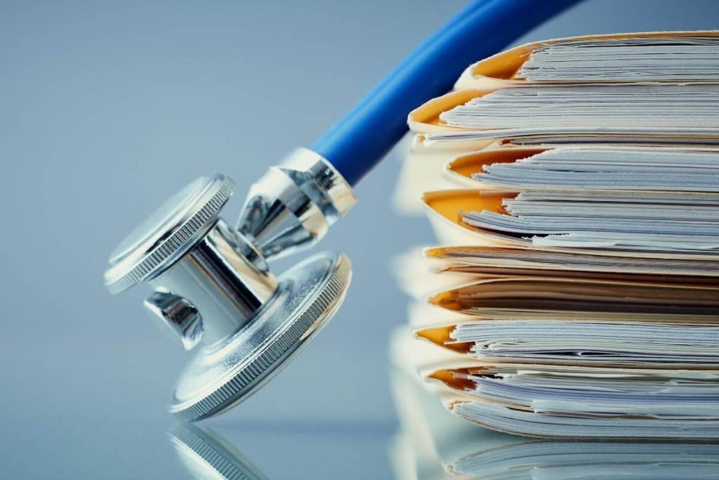 Medical record, research, equipment, files on top of each other, medical codes