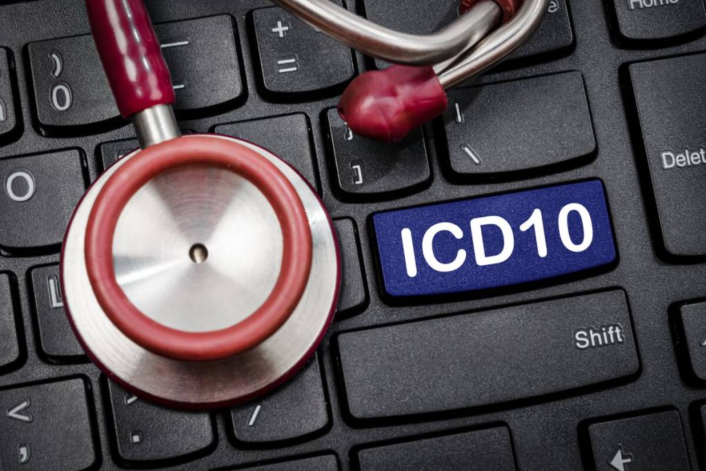 nternational Classification of Diseases and Related Health Problem 10th Revision or ICD-10 and stethoscope medical on computer keyboard.