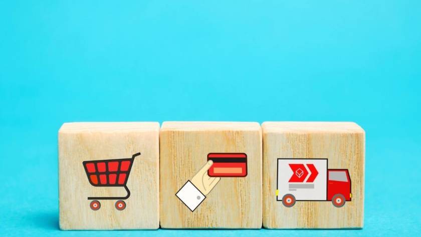 Ecommerce Call Centers - Wooden blocks with online shopping symbols. Shopping card, card for paymernt, delivery truck. Seller over the internet. Ecommerce and delivery service concept.