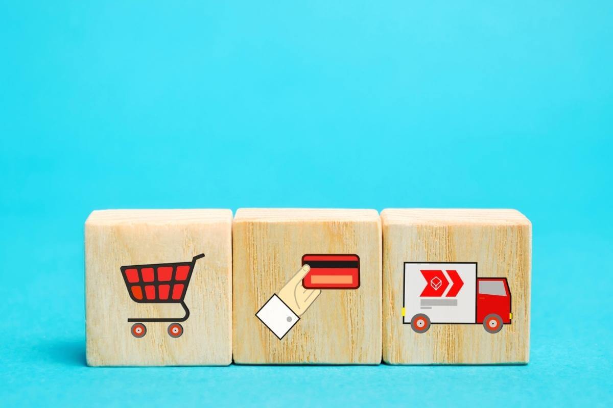 Ecommerce Call Centers - Wooden blocks with online shopping symbols. Shopping card, card for paymernt, delivery truck. Seller over the internet. Ecommerce and delivery service concept.