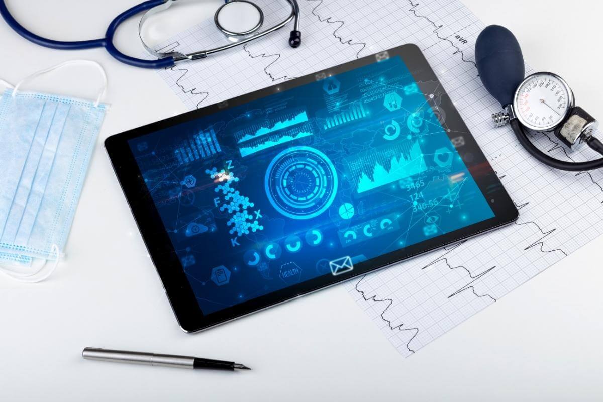 The Four Benefits of Medical Billing Outsourcing - image shot of tablet with healthcare data