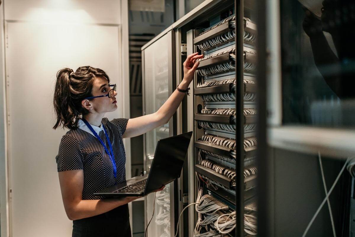 What is an Outsourced It provider - screenshot of a female engineer in data server