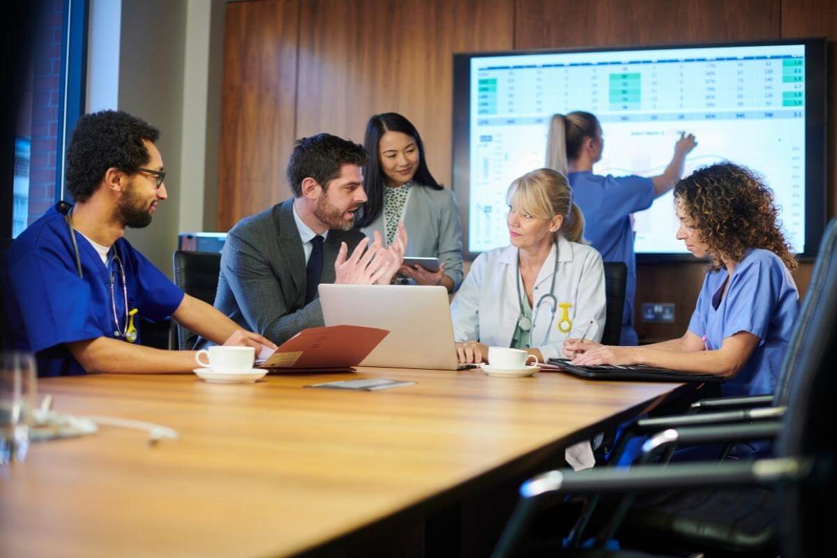 Medical professionals meeting with some business associates