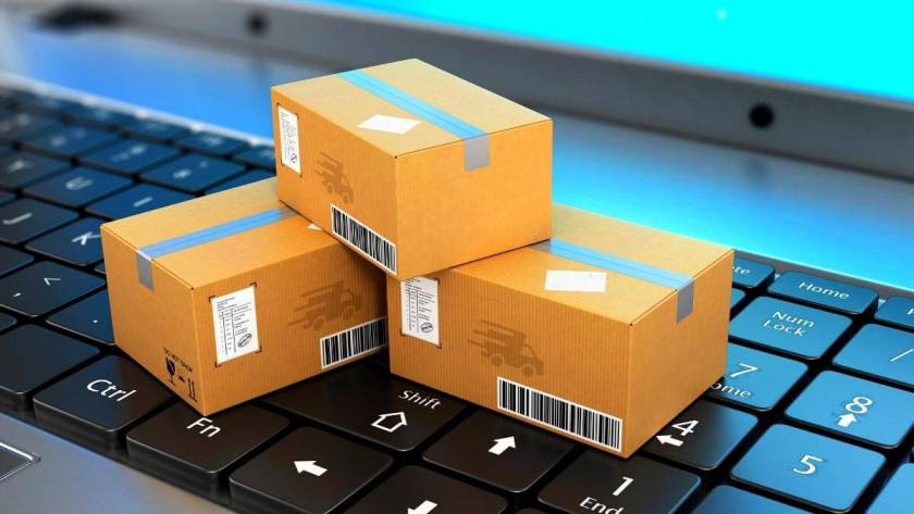 Best Call Center for Ecommerce - Shipping, delivery and logistics. Package on top of a laptop keyboard- ecommerce concept