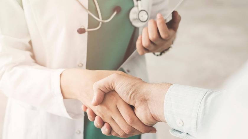 Dermatology Medical Billing Jobs - Doctor shaking hands with another person - medical healthcare concept