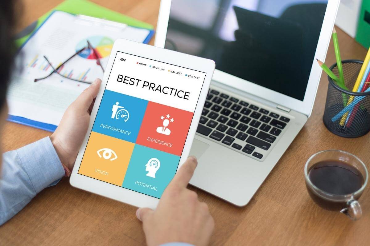 Eight Best Practices- image screenshot of a person holding a tablet with list of best practices