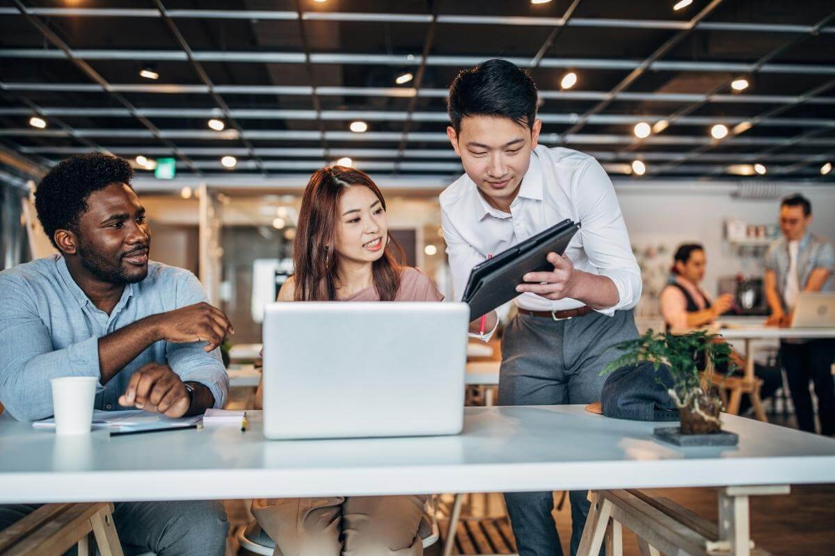 Outsource Back Office Services - Young people working in modern office.