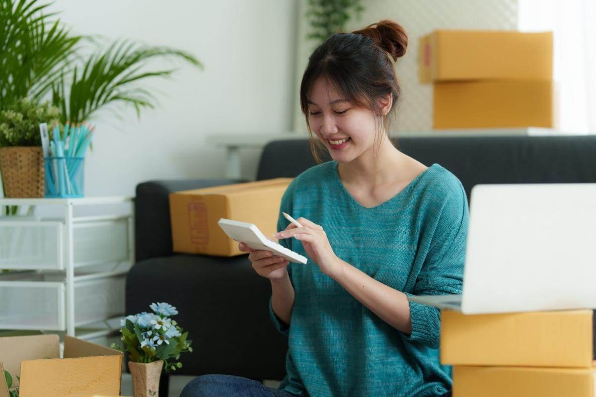 Outsourcing for ecommerce business - image of a small ecommerce business owner working at home