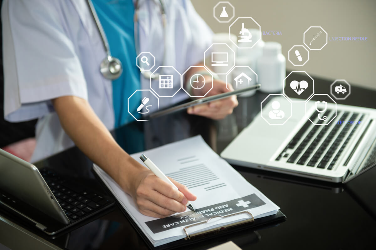 Medicine, healthcare and people concept - male doctor with stethoscope and clipboard at clinic.