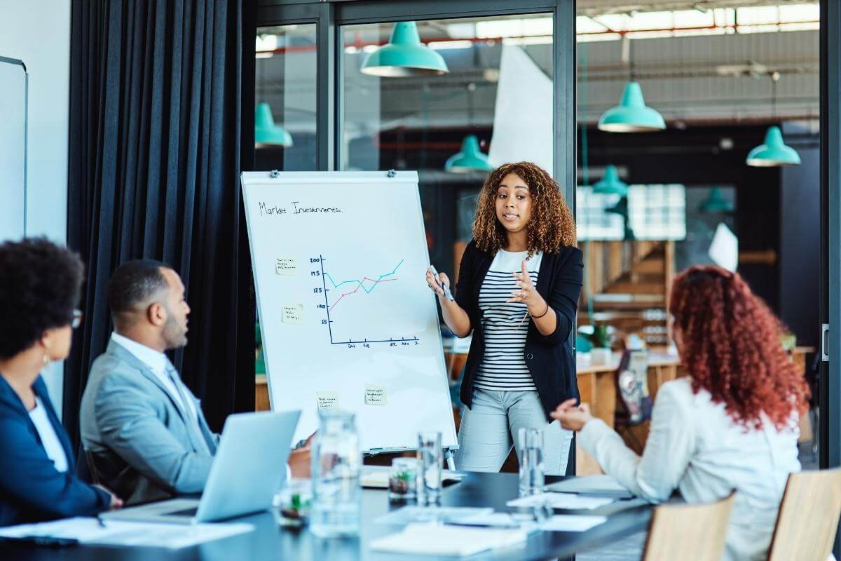 Shot of a businesswoman giving a presentation, showcasing her expertise in an office. 