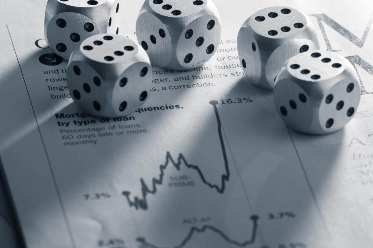  Business risk - image shot of dice over business reports, concept of business risk and drawbacks. 