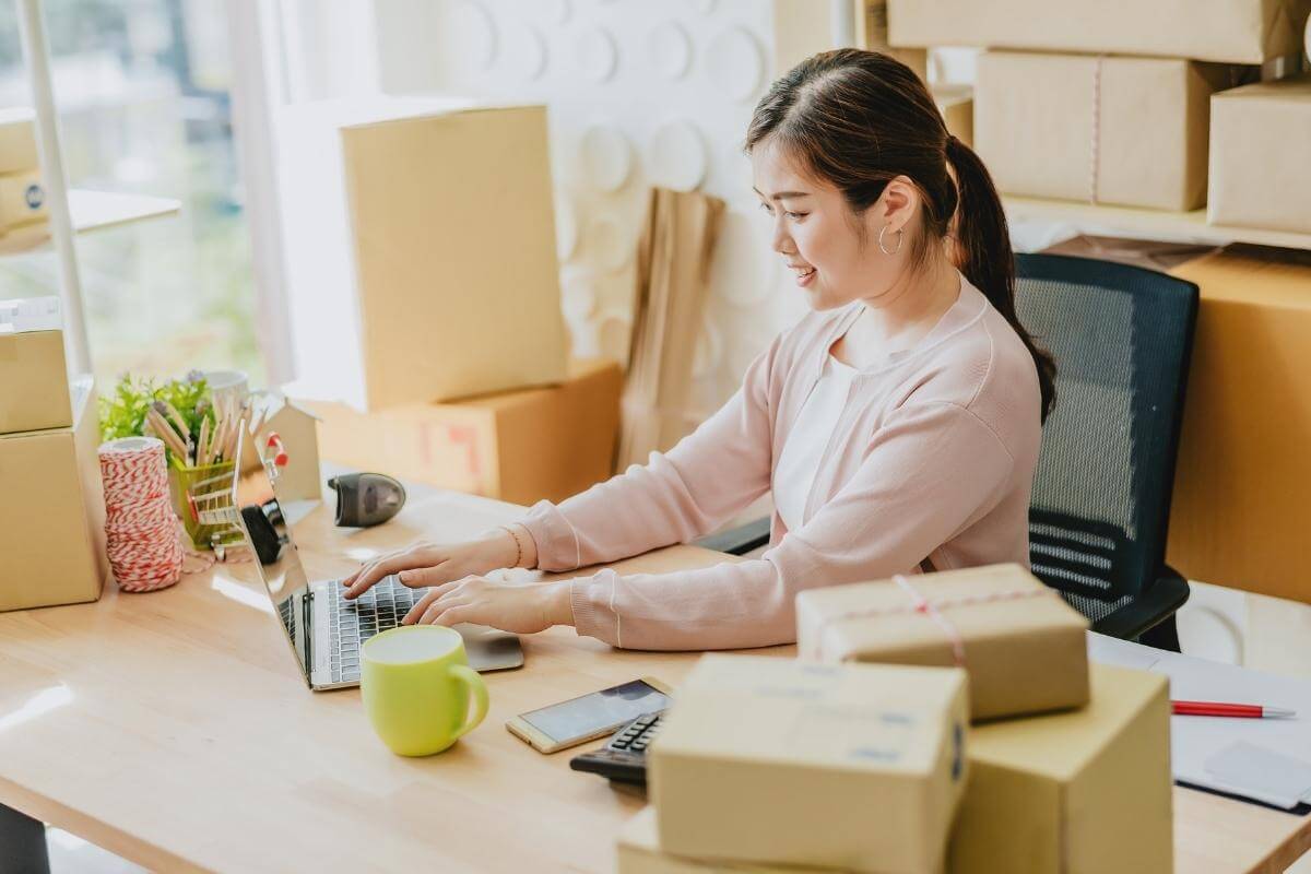 Female Entreprenuer preparing order for delivery. 