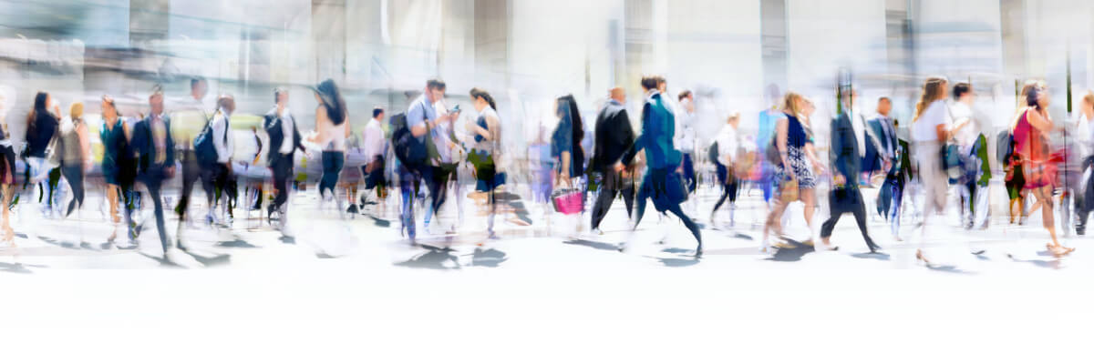 Lots of business people walking in the City of London. Blurred image, wide panoramic view of the road with people at sunny day. 