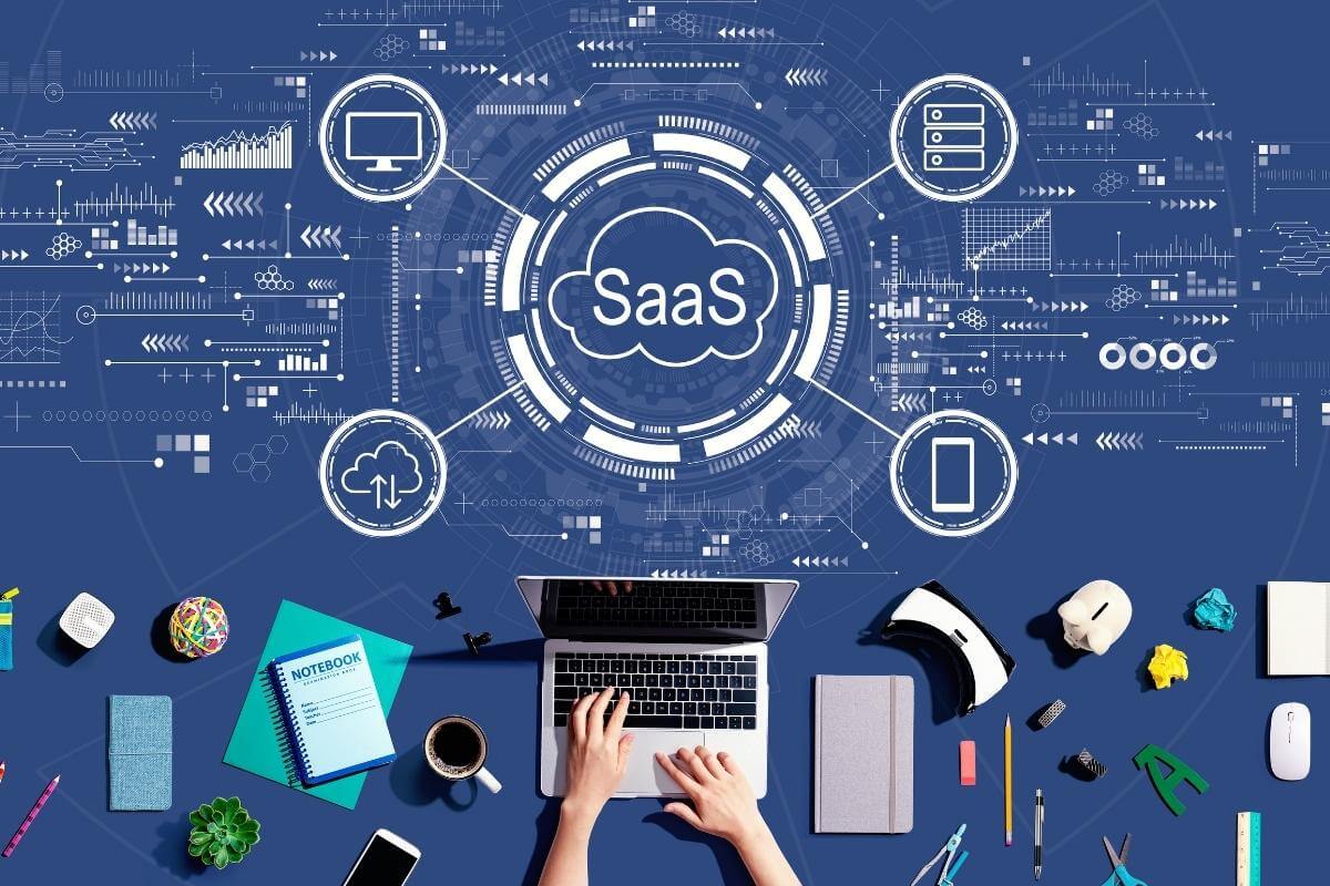  Saas software as a service concept with person using a laptop