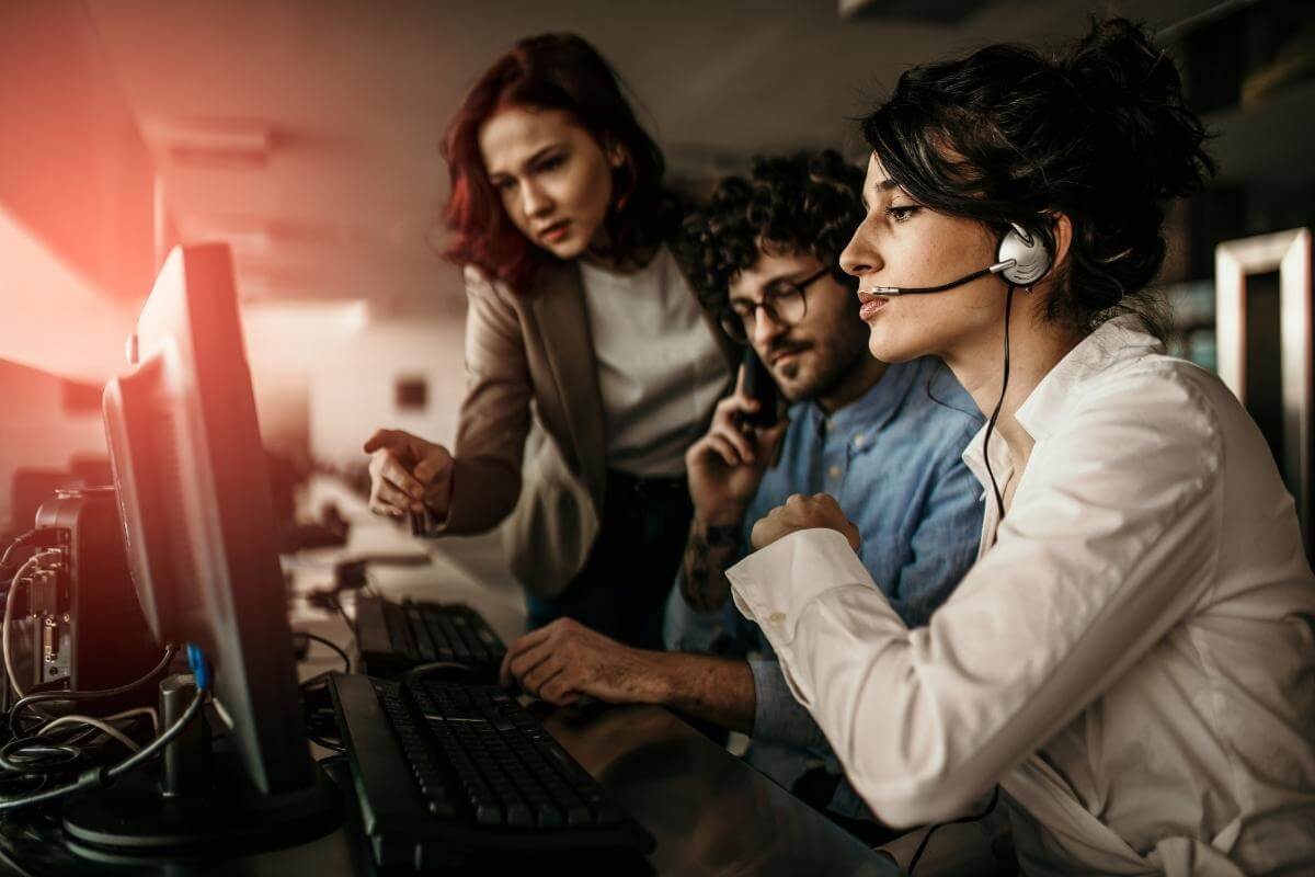  IT support operators assisting users with computer concerns. 