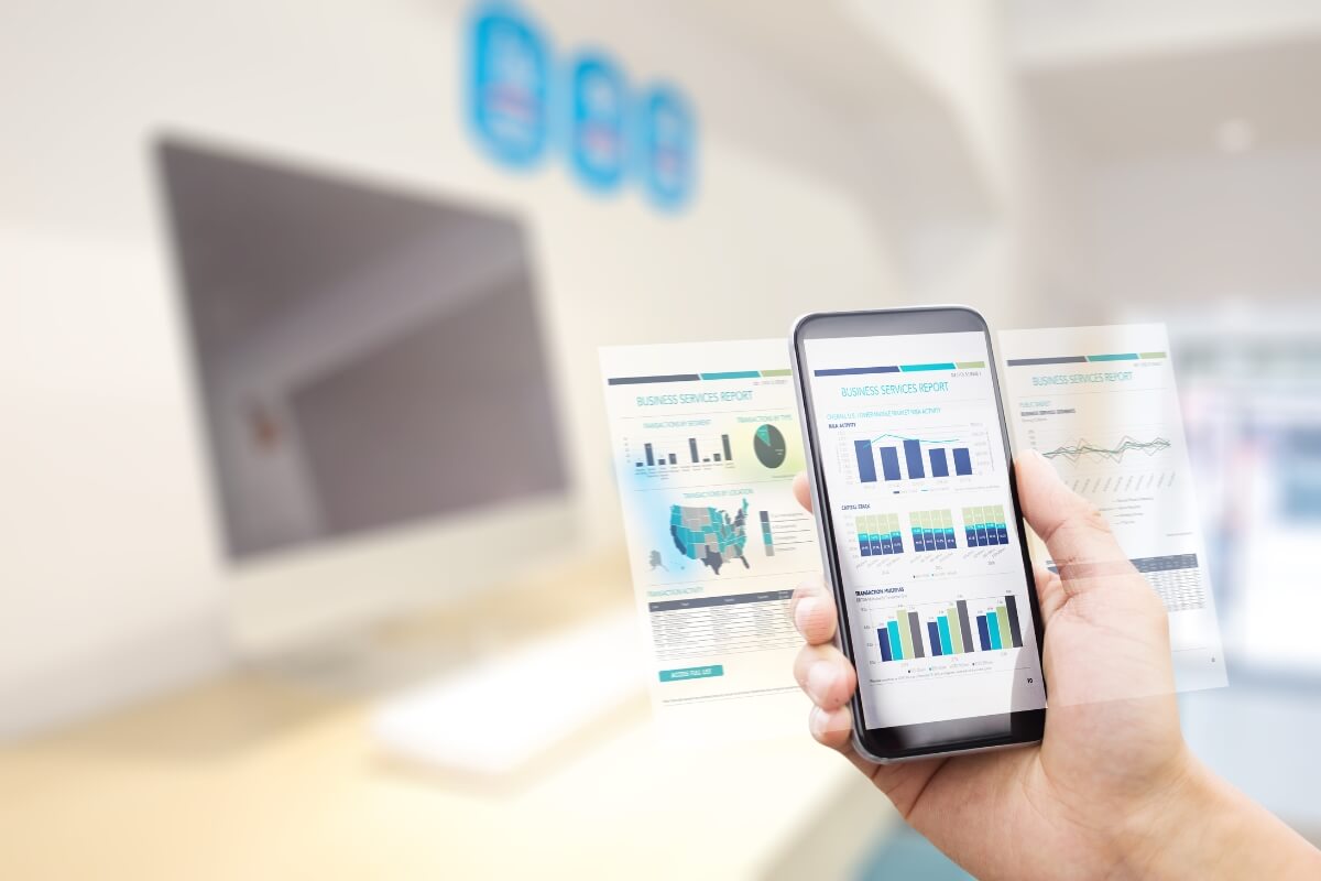 Smart phone showing report in a virtual screen - concept of workplace automation and tools integration. 