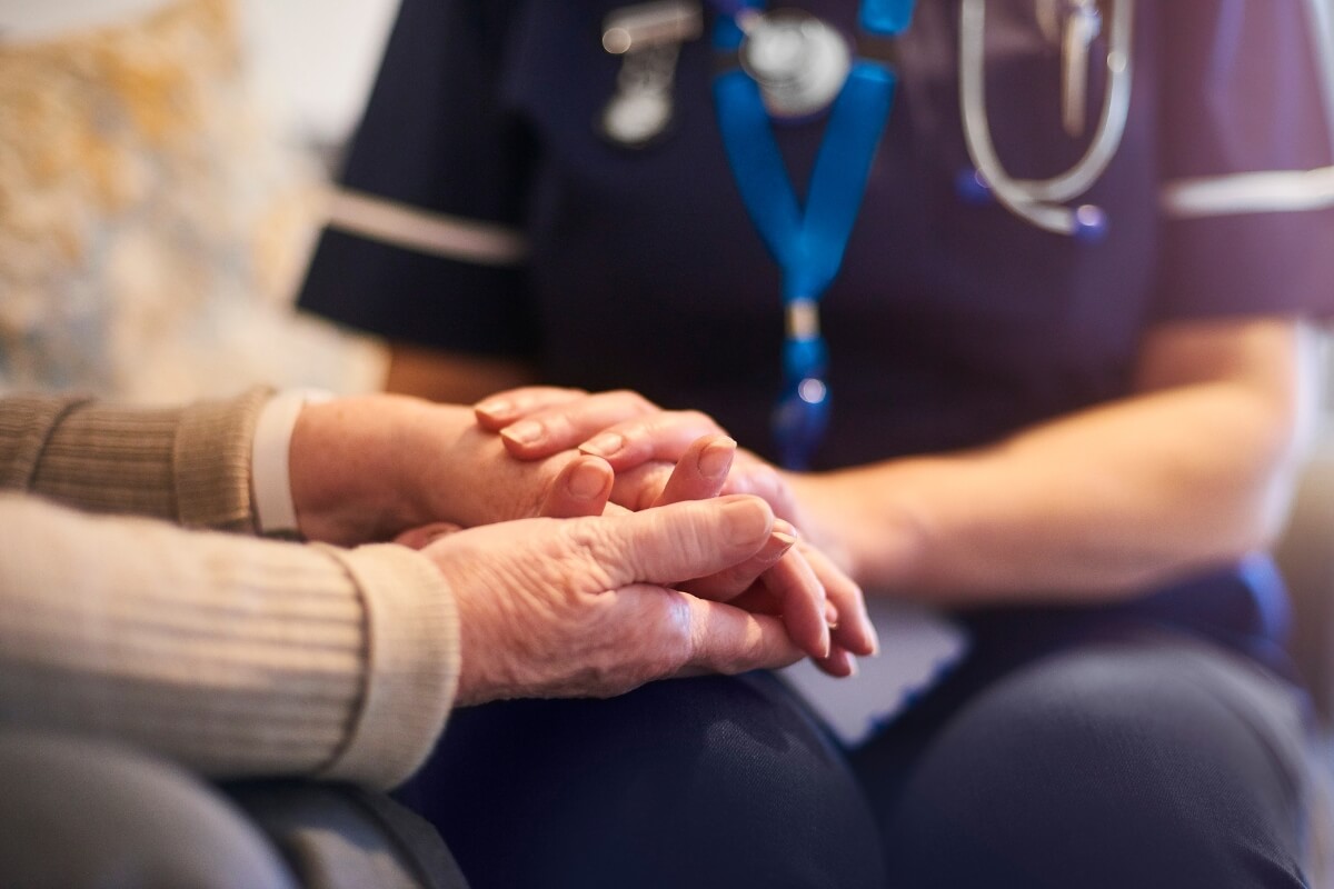  Nurse comforting patient, Improved patient care, support