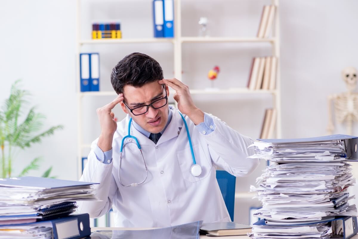 Busy Doctor in a hospital with too much work in the hospital. 