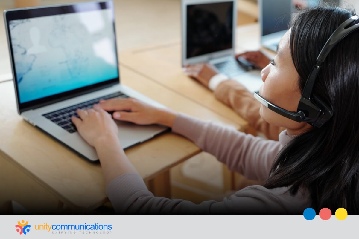 Six Main Contact and Call Center Activities - image shot of a contact center agent working using a laptop answering calls