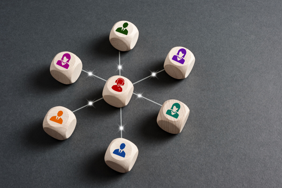 Outsourcing Customer Communications - Featured Image_Customer representative connects with customers. Customer care online help desk, helpline service or business telemarketing concepts.
