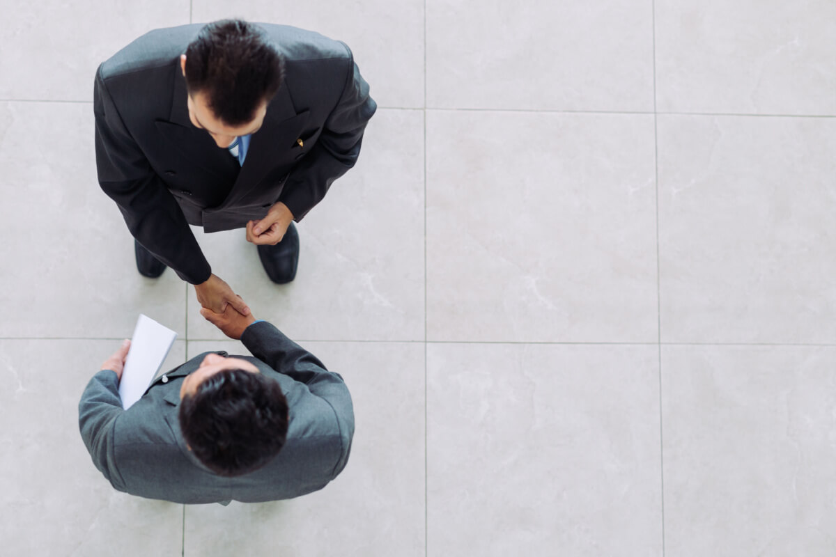 Business partners shaking hands as a symbol of unity, partnership and collaboration